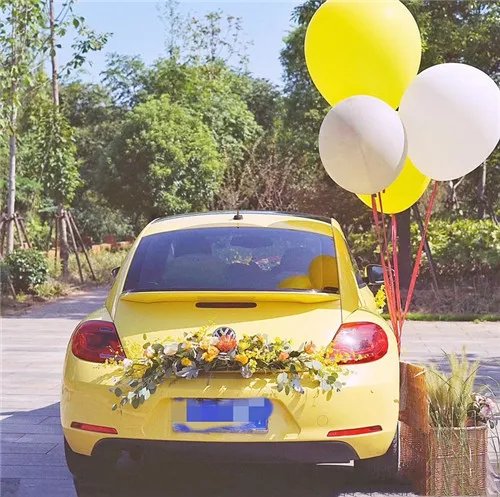 婚礼车花可以如何装饰   婚礼车花用仿真鲜花效果如何